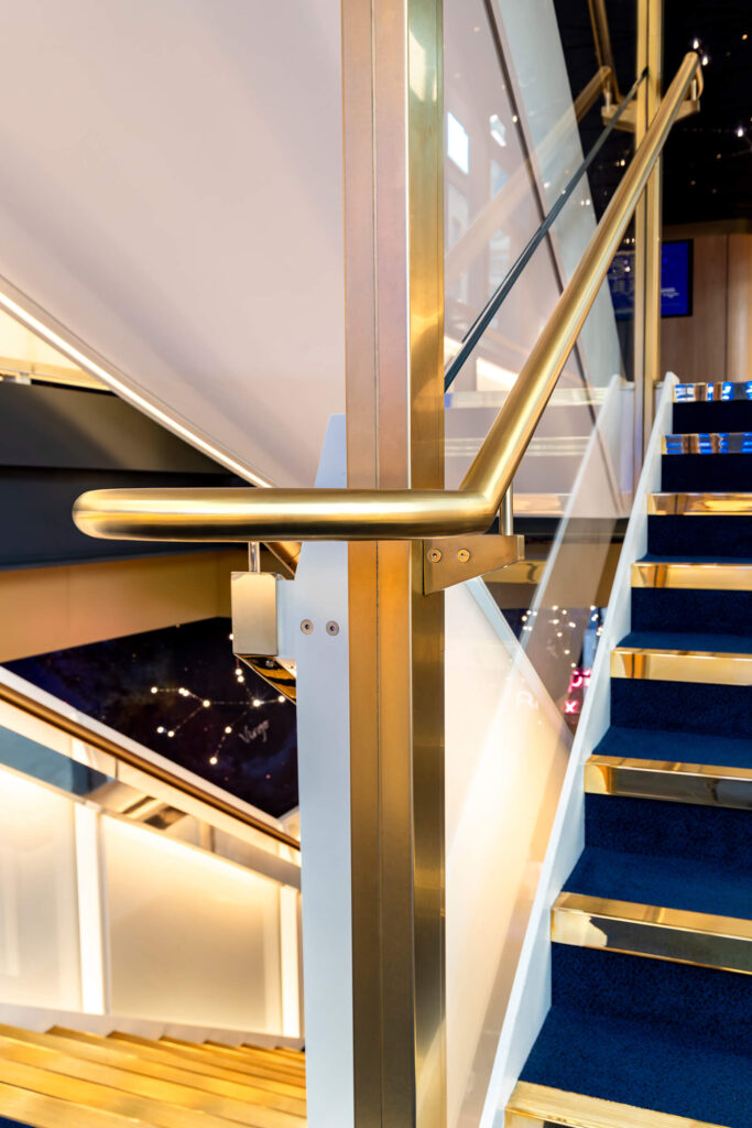 Stair handrail in PVD coloured stainless steel Royal Gold Brush Soho Place Theatre London