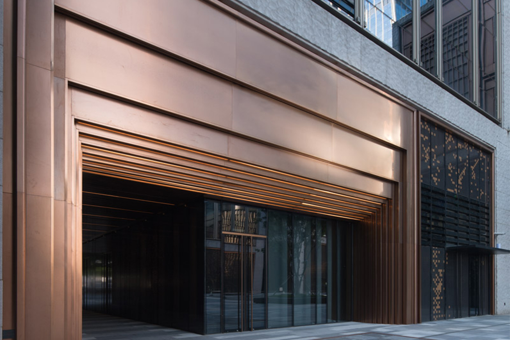 Stepped door entry in PVD coloured stainless steel, Rose Gold Vibration, Shanghai Bund, China.