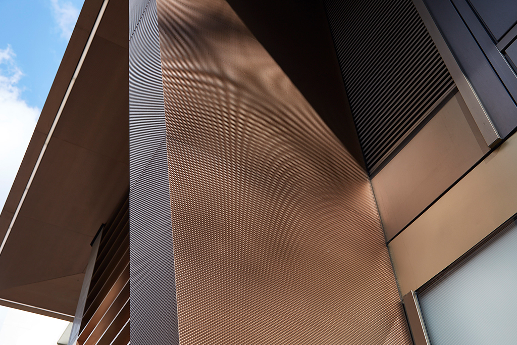 Columns, canopy & brise soleil in PVD stainless steel clad around a timber core to appear as solid bronze, Fetter Lane, London.